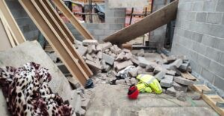 Concrete blocks that had been stored on the upper floor